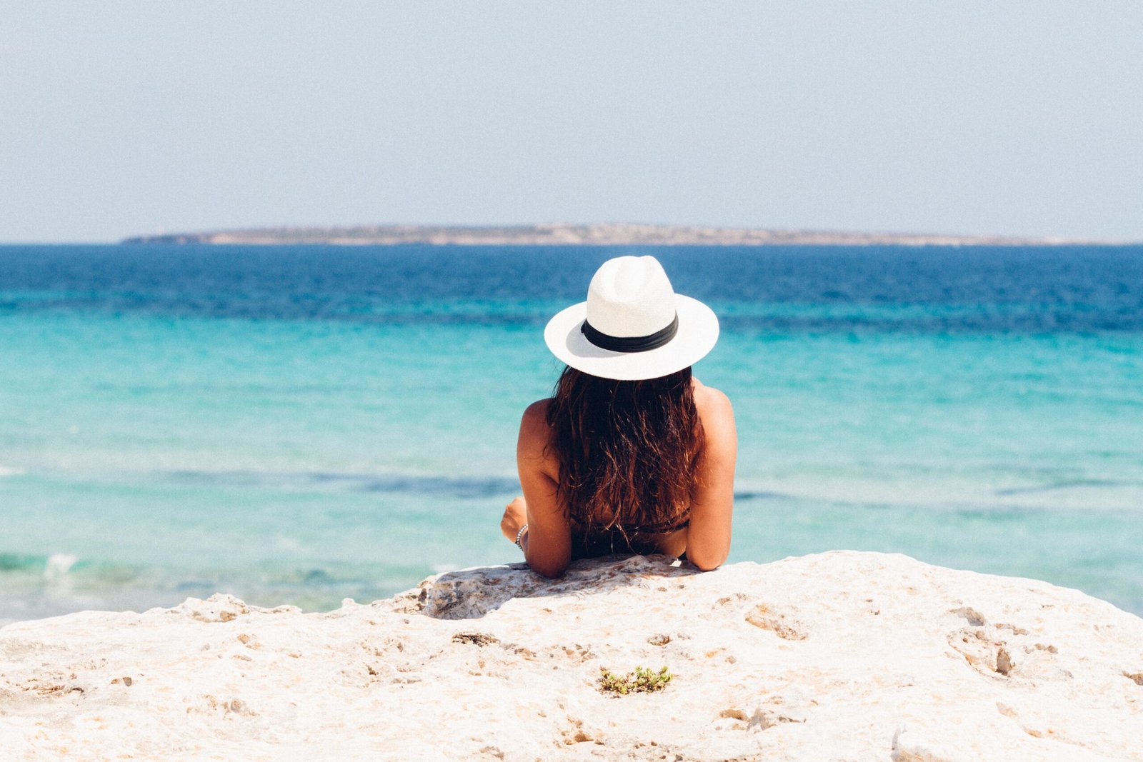 Solo traveler enjoying the peaceful coastline and vibrant atmosphere of Tarifa, Spain.